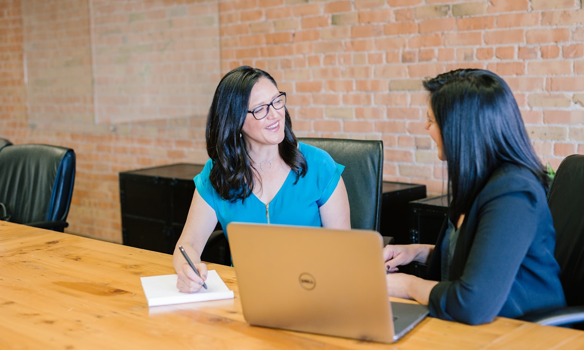 Two people in conversation. The answers live with the people doing the work, not in a report.