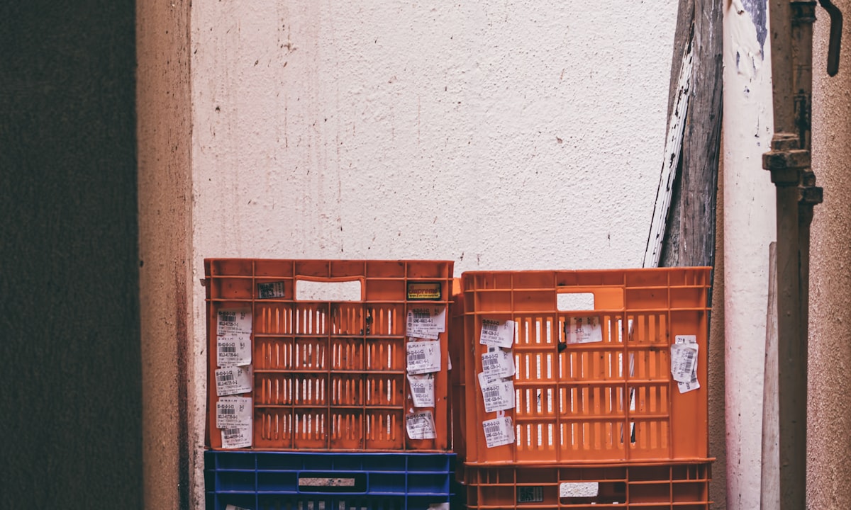 Crates stacked and unused. The licence fee is the smallest part of what shelfware costs you.